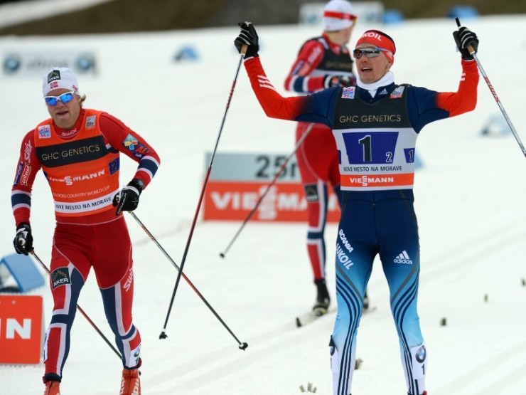 Nikita Kriukov (r) celebrates a 0.22-second victory for Russia I over Norway I's Eirik Brandsdal in Sunday's 6 x 1.6 k classic team sprint. Norway II's Ola Vigen Hattestad placed third, 1.78 seconds back in the final classic sprint before the Olympics. (Photo: Fischer/Nordic Focus)