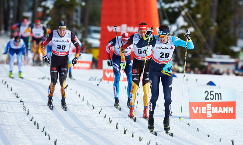 Alexey Poltaranin (KAZ) finishes for the win in Lenzerheide, Switzerland. Photo: Fischer/NordicFocus