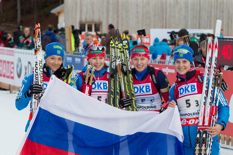 Irina Starykh (far right) celebrates with the Russian team after their IBU World Cup biathlon relay victory in Ruhpolding, Germany, in January. Photo: Fischer / Nordic Focus.