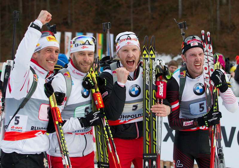 Team Austria celebrates their IBU World Cup biathlon relay victory in Ruhpolding (GER).  (l to r) Christoph Sumann (AUT), Daniel Mesotitsch (AUT), Simon Eder (AUT), Dominik Landertinger (AUT) .  Photo: Fischer / Nordic Focus.