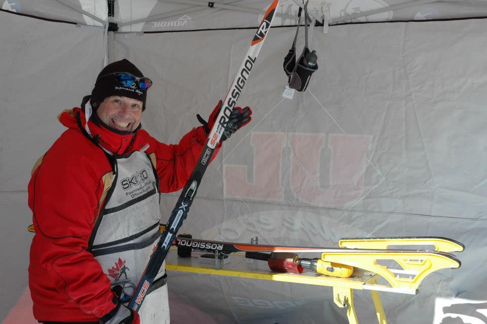 Laval head coach Luc Germain prepping skis for athletes (Photo: Rouge et Or)