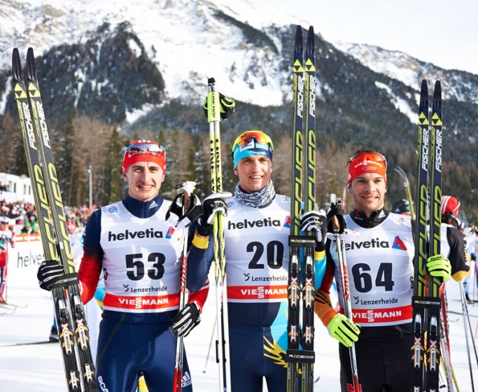 Men's podium - Volzhentsev, Poltaranin, Dotzler. Photo: Fischer/NordicFocus 