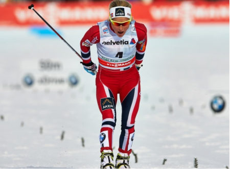 Johaug Finishing.  Photo: Fischer/Nordic Focus