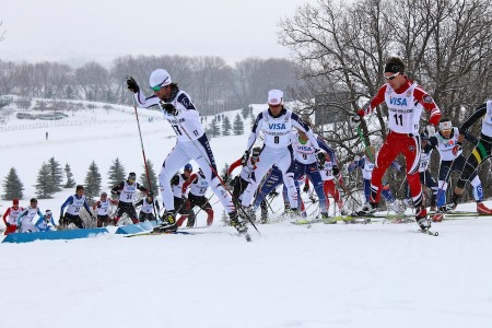 Tad Elliott (l) and Sylvan Ellefson (8) of SSCV/Team HomeGrown make their way up the last hill on the third of six laps with Mats Resaland (11) in the 30 k freestyle mass start at U.S. nationals at Soldier Hollow.