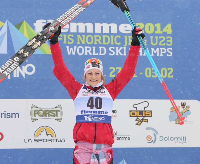 Martine Elk Hagen (NOR) celebrates her win in the women's 10 k individual classic at the 2014 U23 World Championships in Val di Fiemme, Italy. (Photo: Fiemme 2014)  
