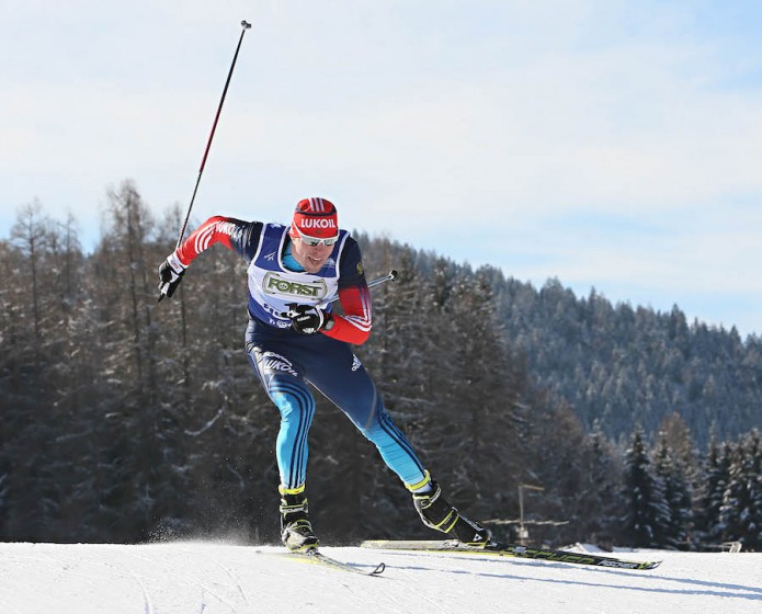 Russia's Sergey Ustiugov on his way to winning Wednesday's freestyle sprint on the first day of U23 World Championships in Val di Fiemme, Italy. (Photo: Fiemme2014)