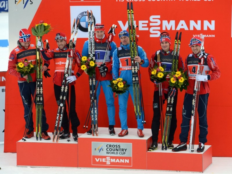 The World Cup men's classic team sprint podium in Nove Mesto, Czech Republic: (from left to right) runner-up Norway I, winner Russia I, and Norway II in third. (Photo: Fischer/Nordic Focus)