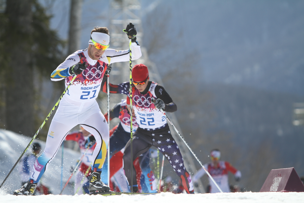Noah Hoffman (bib 26) skiing with Anders Soedergren of Sweden inthe Olympic 50 k.