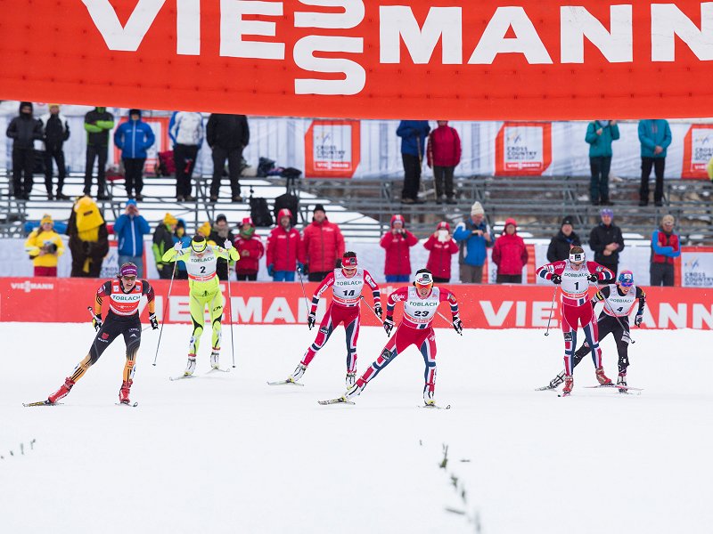 Norway's Marit Bjørgen powers to the finish while trying to hold off Germany's Denise Herrmann (l) and two Norwegian teammates, Ingvild Flugstad Østberg (1) and Maiken Caspersen Falla (14). Bjørgen ended up winning by 0.43 seconds, Herrmann was second, Østberg third, and Falla fourth. American Kikkan Randall (r) placed fifth and Slovenia's Katja Visnar (2) took sixth. (Photo: Fischer/NordicFocus)