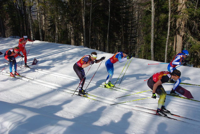 Andy Newell (center) skiing in the main pack of the Olympic men's relay today.