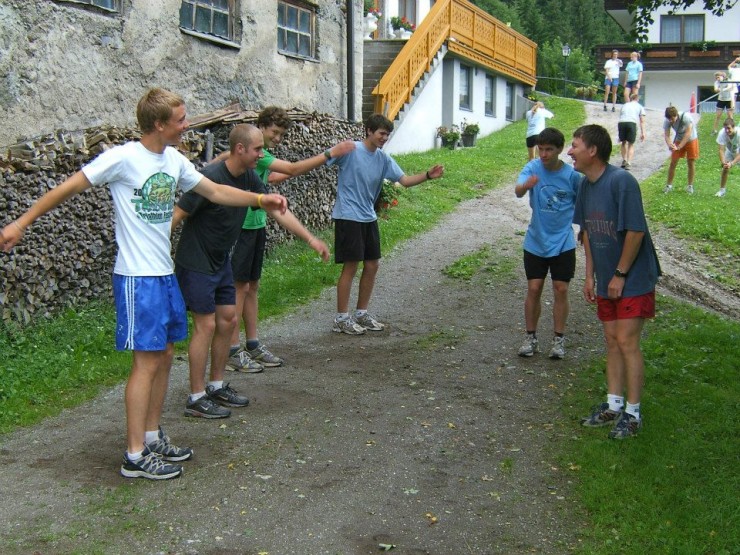 Igor Badamshin (right) laughing through technique work with (from left) Alex Howe, Dylan McGuffin, and other athletes on a junior training camp. Photo: Martina Howe.