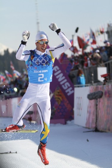 Sweden's Marcus Hellner jumps out of his skis after anchoring his country to victory in the men's 4x10 relay at the Sochi Olympics.