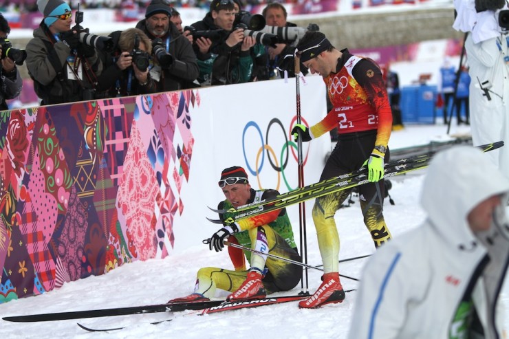 Germany's Tim Tscharnke (l) after the finish of the 2014 Olympic team sprint with teammate Hannes Dotzler. The two finished seventh after Tscharnke fell a few hundred meters before the finish as a result of a tangle with Finnish anchor Sami Jauhojärvi. Finland took gold and Germany placed seventh. 