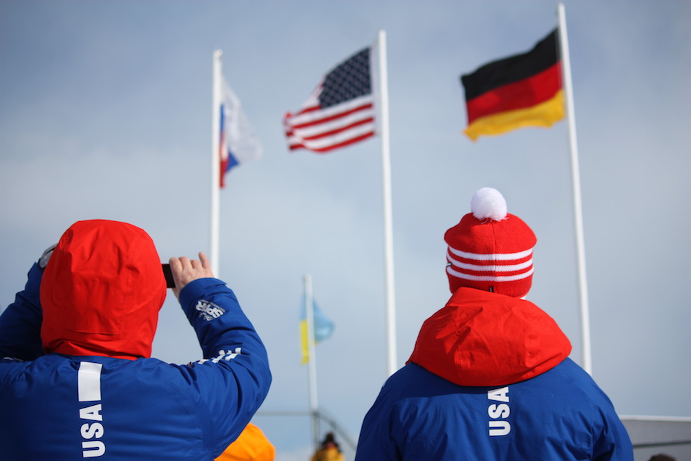 US Biathlon staff snap a photo of the youth men's podium on Friday in Presque Isle, Maine, as represented in flags after Sean Doherty topped Germany by 1.7 seconds and Russia by nearly 19 seconds for the win. (Photo: Craig Cormier)