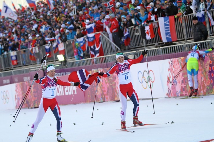Norwegian teammates and friends Maiken Caspersen Falla (l) and Ingvild Flugstad Østberg celebrate gold and silver, respectively, in Tuesday's Olympic skate sprint in Sochi, Russia.