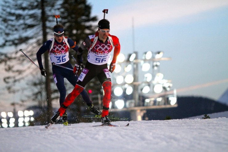 Canada’s Jean-Philippe Le Guellec (56) leads Norway's Tarjei Bø in the men's Olympic biathlon 20 k individual on Thursday in Sochi, Russia. Le Guellec went on to place 35th and Bø was 26th. 