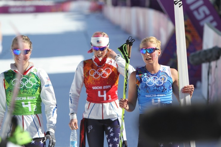 U.S. teammates Sadie Bjornsen (l), Kikkan Randall (c) and Jessie Diggins at the finish of Saturday's Sochi Olympic relay, in which they placed ninth with Liz Stephen. 