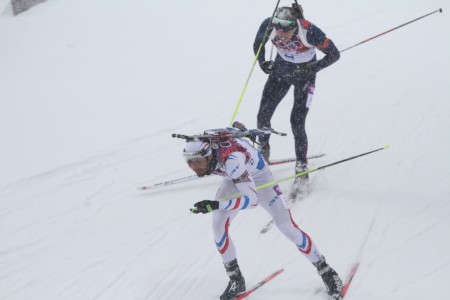 France's Martin Fourcade leads Norway's Emil Hegle Svendsen toward the finish in the men's biathlon 15 k mass start on Tuesday at the 2014 Sochi Olympics in Krasnaya Polyana, Russia.