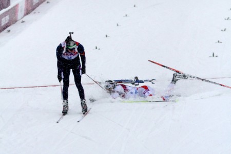 Norway's Emil Hegle Svendsen (l) wins gold in a photo finish with France's Martin Fourcade (r) in the men's 15 k mass start on Tuesday at the 2014 Sochi Olympics in Krasnaya Polyana, Russia.