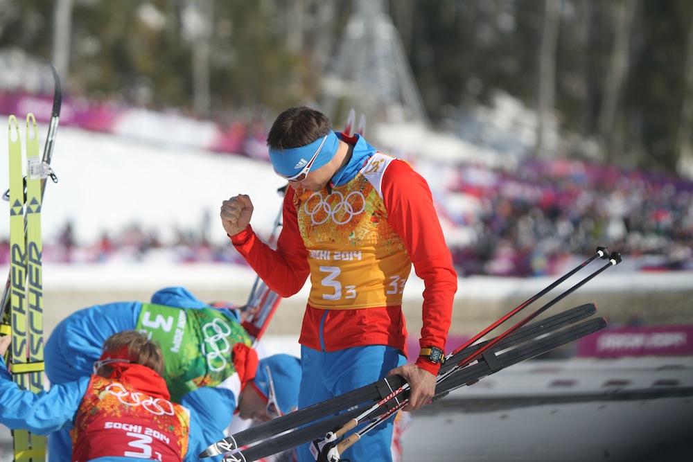 Alexander Legkov celebrates Russia's silver in the men's 4 x 10 k relay, their nation's first medal in cross-country at the Sochi Olympics. He went on to win gold in the final race of the Sochi Games, the 50 k freestyle mass start, and Russia swept the podium.
