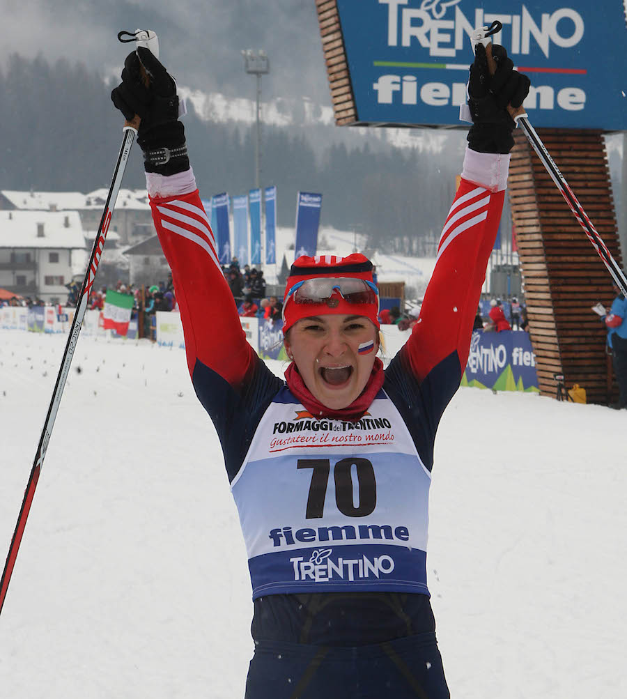 Russia's 18-year-old Natalia Nepryaeva celebrates her 2.7-second victory in Sunday's 5 k classic individual start for her first title at Junior World Championships in Val di Fiemme, Italy. (Photo: Fiemme2014)
