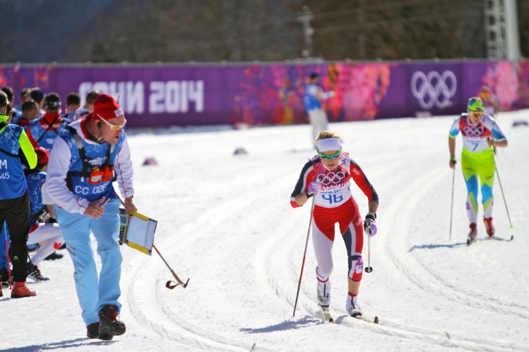 Therese Johaug races to bronze as Norwegian women's sprint coach Roar Hjelmeset calls out to her.