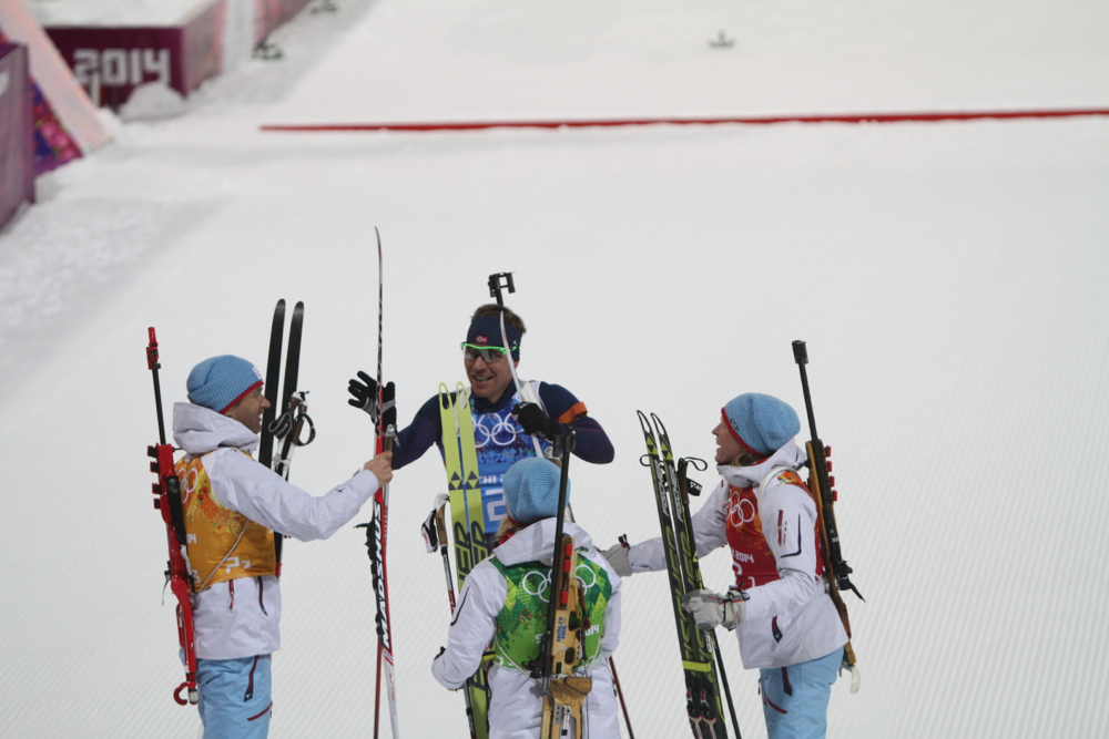 The Norwegian biathlon team celebrates gold in the first-ever Olympic mixed relay after Emil Hegle Svendsen showboated his way toward the finish line.