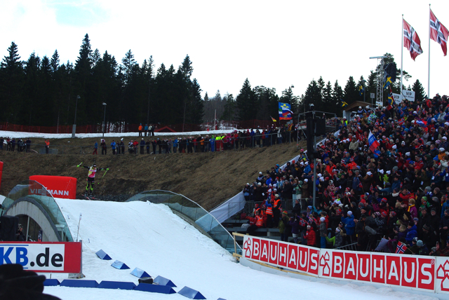 Martin Fourcade gets some air over the final roller coming into the stadium...