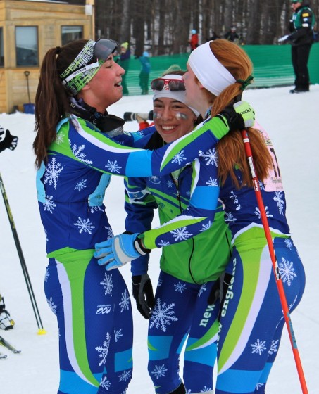 New England's Zoe Snow (r), Katharine Ogden (c) and Julia Kern (l) celebrate their U18 women's 3 x 3 k freestyle relay victory on Saturday at Junior Nationals in Stowe, Vt.