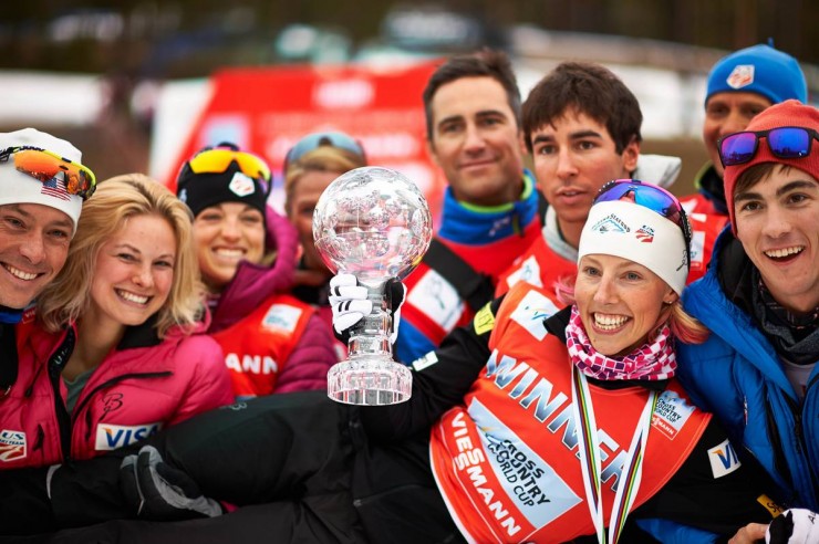 Several members of the U.S. Ski Team lift up Kikkan Randall after she won her third-straight World Cup sprint Crystal Globe on Friday in Falun, Sweden. (Photo: Fischer/Nordic Focus)