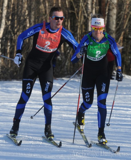 Reese Hanneman of Alaska Pacific University's (APU) first team tags Sadie Bjornsen (APU/USST) in the lead at the U.S. Distance Nationals 4 x 5 k mixed relay on Tuesday in Anchorage, Alaska. (Photo: Bill Roth/Anchorage Daily News)