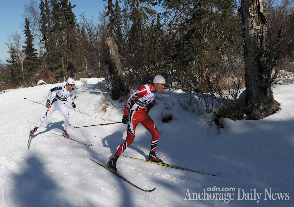 Finnish skier Aku Nikander (r) of the University of New Mexico leads Noah Hoffman of the U.S. Ski Team around a corner on the Spencer Loop during the final lap of the men's 50 k classic race at the U.S. Distance Nationals at Hillside in Anchorage, Alaska. (Photo: Erik Hill/Anchorage Daily News)