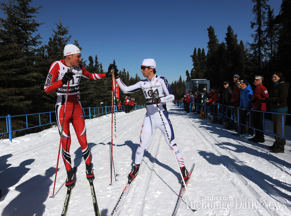 Winner Aku Nikander of the University of New Mexico (l) and runner-up and first American Noah Hoffman of the U.S. Ski Team congratulate each other after finishing the men's 50 k classic race at U.S. Distance Nationals on Friday. (Photo: Erik Hill/Anchorage Daily News)