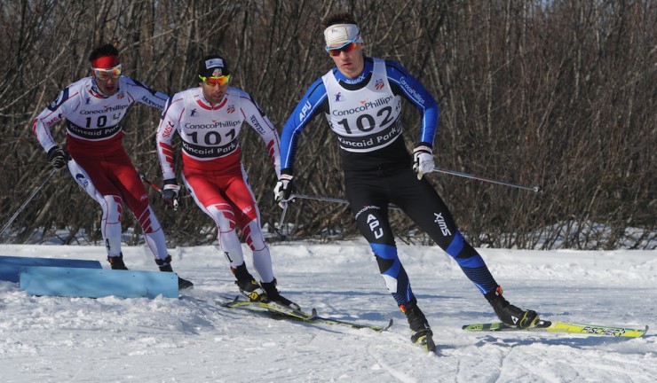 (Reese Hanneman (102) leads Andrew Newell (101) and Benjamin Saxton (104) while skiing to victory during the men's final at the Super Tour Finals classic sprint races at Kincaid Park on Sunday in Anchorage, Alaska. (Photo: Bill Roth/Anchorage Daily News)