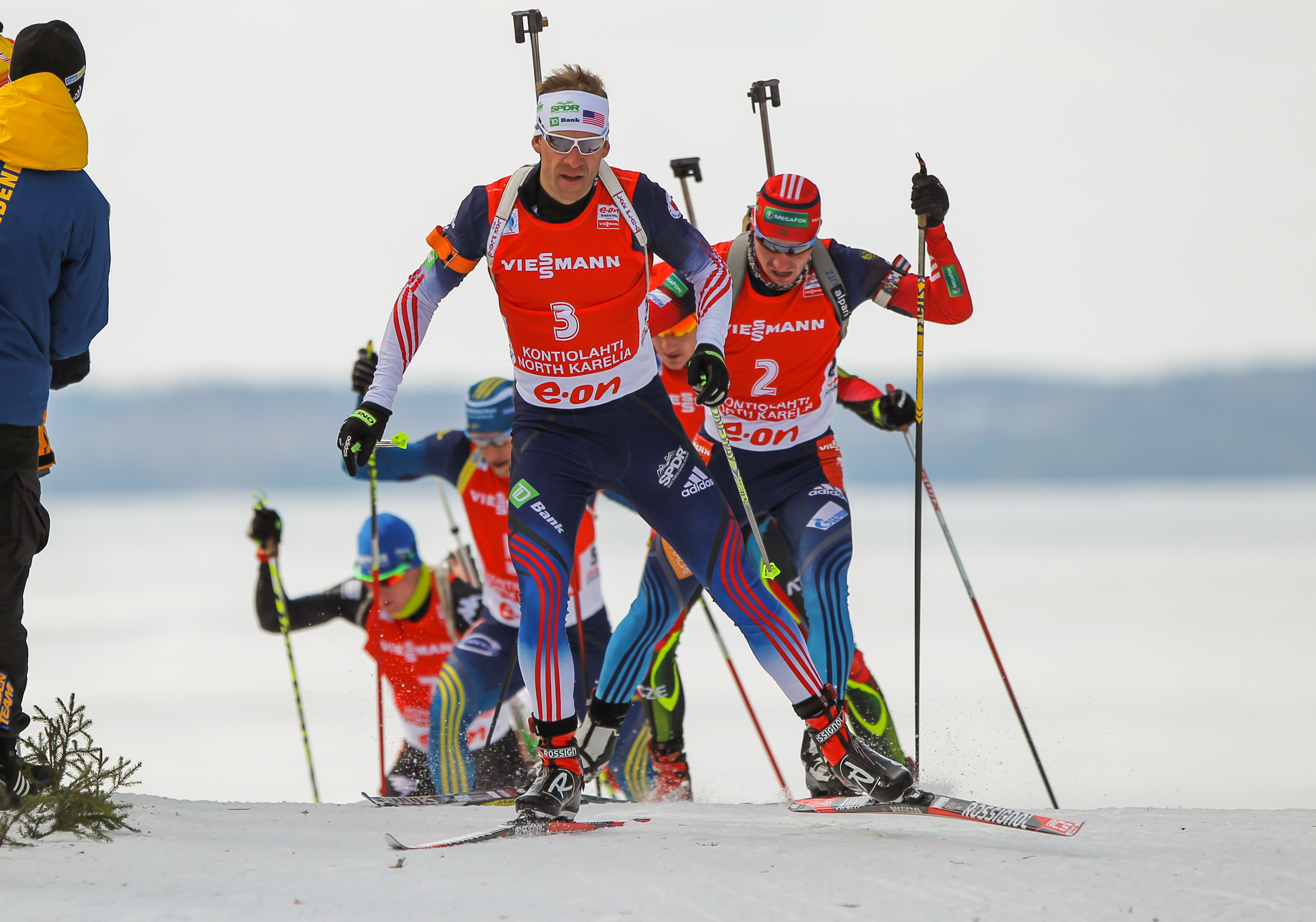 Lowell Bailey (USA) leading Alexander Loginov of Russia in last season's World Cup pursuit in Kontiolahti, Finland. In the sprint, Loginov had placed second and Bailey third; a previous sample of Loginov's has tested positive for EPO. (Photo: USBA/NordicFocus.)