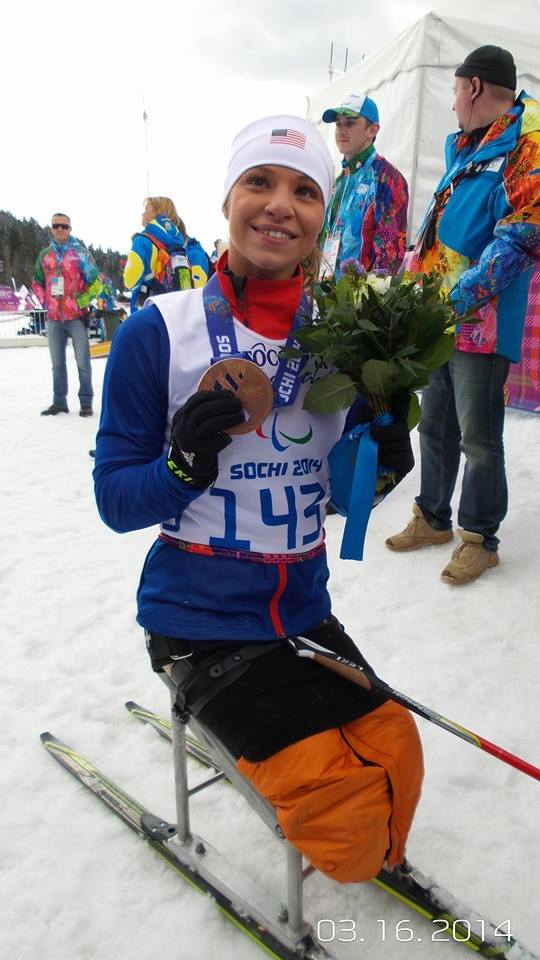 Oksana Masters with her bronze medal following the women's 5 k sit-ski race.  (Photo Kevin Bittenbender U.S. Paralympics Nordic)