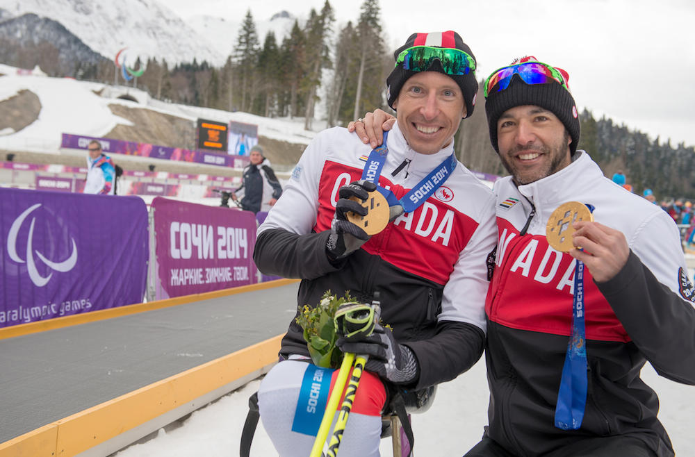 Chris Klebl with his Men's 10km Sitting gold medal and Brian McKeever with his 15km free Visually Imaired gold medal at the 2014 Paralympic Winter Games in Sochi, Russia. (Photo: Matthew Murnaghan/Canadian Paralympic Committee)
