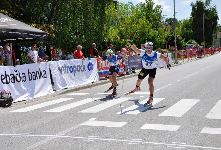 Russian Victor Karasev (r) lunges to claim victory over Alessio Berlanda of Italy in the final sprint of the FIS Rollerski World Cup in Oroslavje, Croatia. (Photo: FIS/Flavio Becchis)