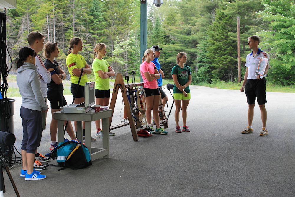 Athletes learn about shooting and range procedure from U.S. Women's Coach Jonne Kahkonen during the Talent ID camp in July, 2014.