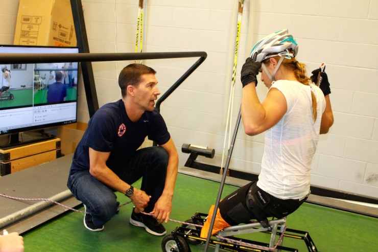 U.S. Paralympics Nordic director and coach John Farra (l) briefs Oksana Masters before her first-ever time on a treadmill at the Olympic Training Center on Sept. 16 in Lake Placid, N.Y.