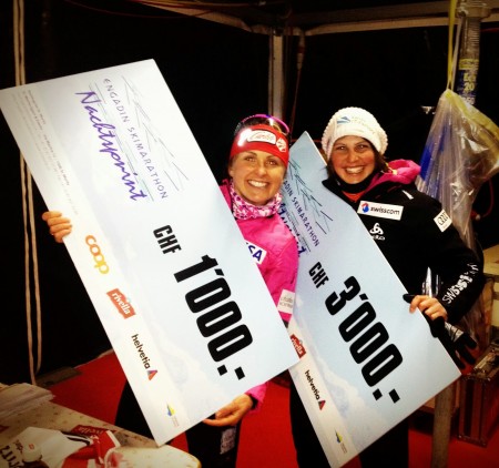 Holly Brooks (l) and Switzerland's Bettina Gruber after placing third and first, respectively in the St. Moritz night sprints before last year's Engadin Marathon, in which Brooks placed fourth after a late crash. (Photo: http://hollyskis.blogspot.com/2014/03/home-sweet-home.html)