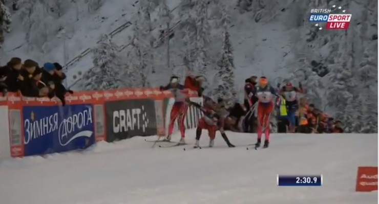 Kowalczyk (c) stumbles over her snow-packed skis just after topping the final climb in her semifinal, while Bjørgen (l) and Brun-Lie (r) go around her.  