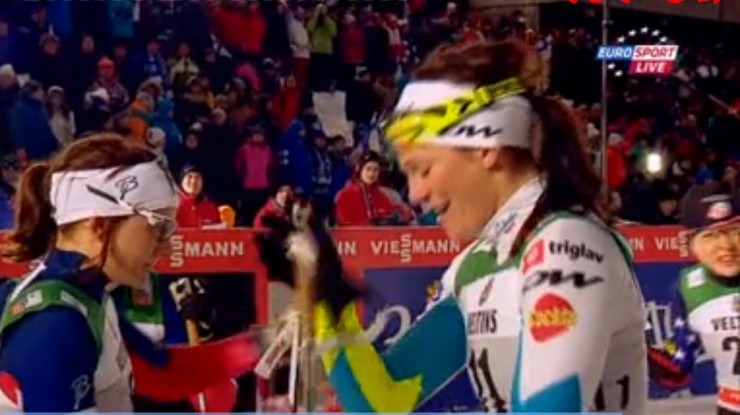 Slovenia's Katja Visnar, who finished second in Saturday's classic sprint, after getting hugs from the three Norwegians, including Maiken Caspersen Falla (l), in the final in Kuusamo, Finland.