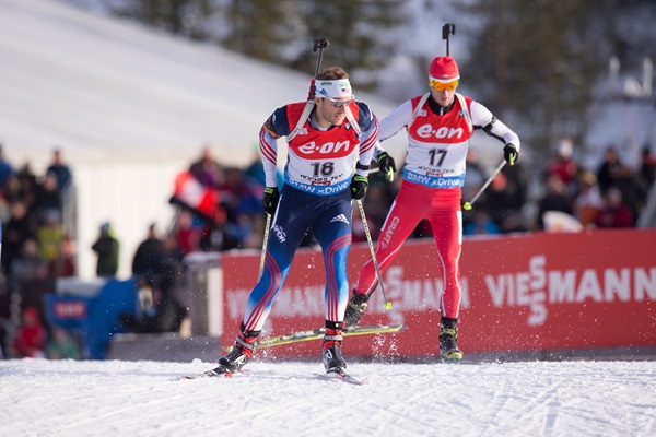 Lowell Bailey leads Bulgaria's Krasimir Anev during Sunday's 12.5 k pursuit in Hochfilzen, Austria. After starting 18th, Bailey went on to place 32nd. (Photo: USBA/NordicFocus)