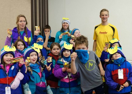 Eric Packer and a group of kids enjoy some recovery food at the end of the ski at Lickety-Splits Ski Camp for Kids on Dec. 22 in Anchorage, Alaska. (Courtesy photo)