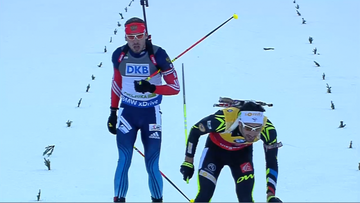 Friday's sprint winner, Anton Shipulin of Russia (l) stands up after catching France's Martin Fourcade at the finish. Fourcade started 30 seconds ahead of him and ultimately placed fourth. 