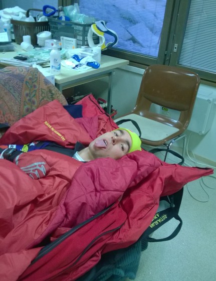 Noah Hoffman at the Ruka clinic in Kuusamo, Finland, on Sunday after breaking his fibula in the 15 k classic. He and physical therapist Peter Dickinson had to wait in the clinic while waiting for an ambulance to take them to a nearby medical center for X-rays. "We were only going half a kilometer and I thought the ambulance was overkill," Hoffman wrote on his blog. (Photo: Peter Dickinson via NoahHoffman.com)