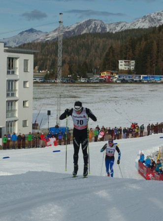 Dario Cologna (SUI) double-poling uphill in Davos. His skate skis took him to third place in the 15 k classic.