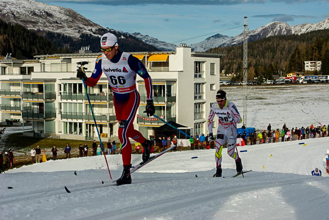 Canada's Devon Kershaw (r) attempts to catch a ride from Norway's Pal Golberg in the World Cup 15 k classic today in Davos, Switzerland. Devon passed Golberg shortly thereafter when Golberg "exploded." 