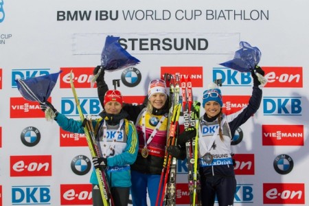 Women's podium (l-r): Semerenko, Mäkäräinen, and Wierer. Photo: Fischer/NordicFocus.com.